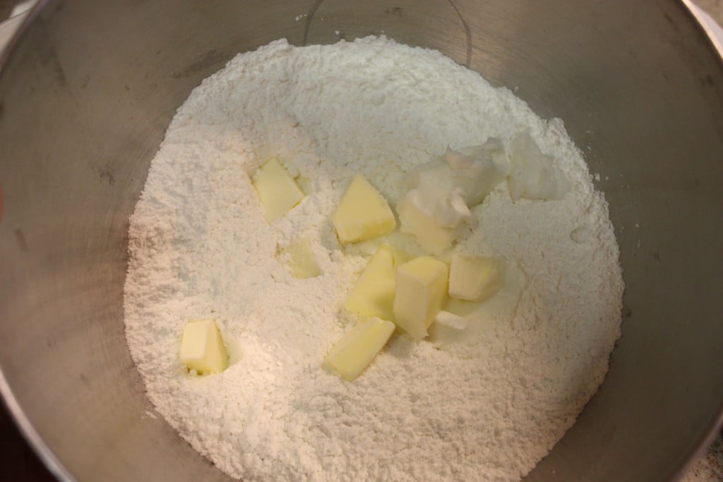 Cubed butter and flour in a bowl.