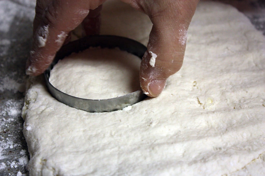 Cutting the homemade biscuit dough.