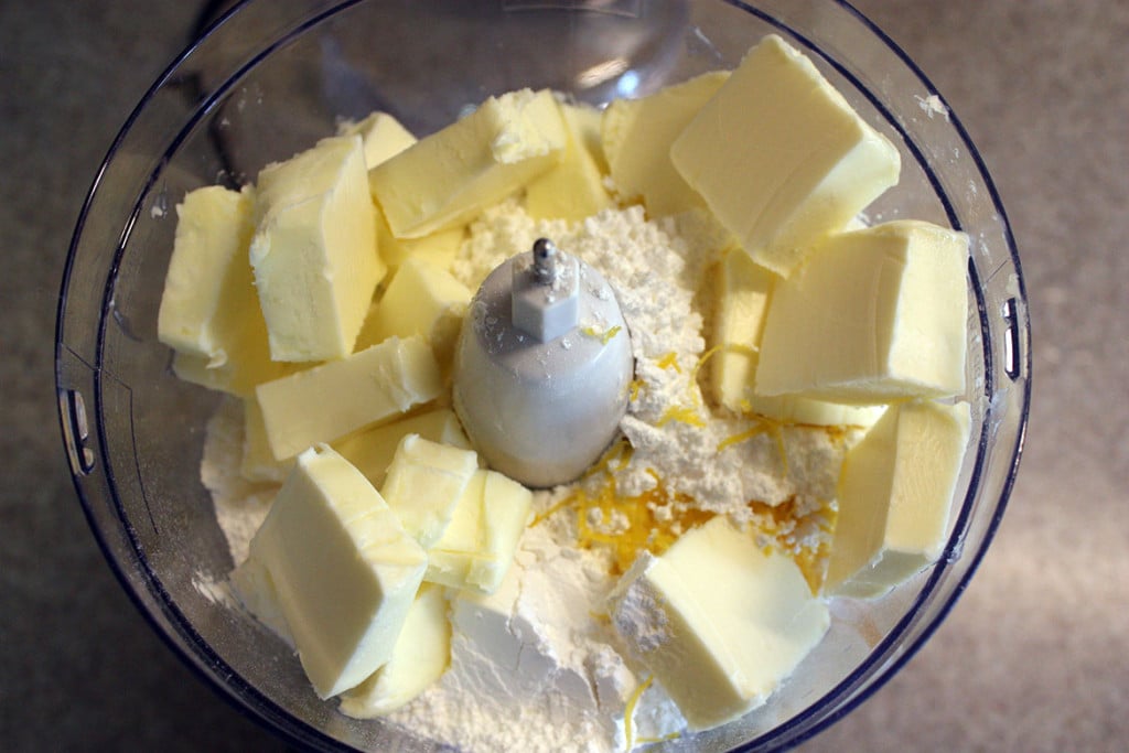 Butter and flour in the bowl of a food processor.
