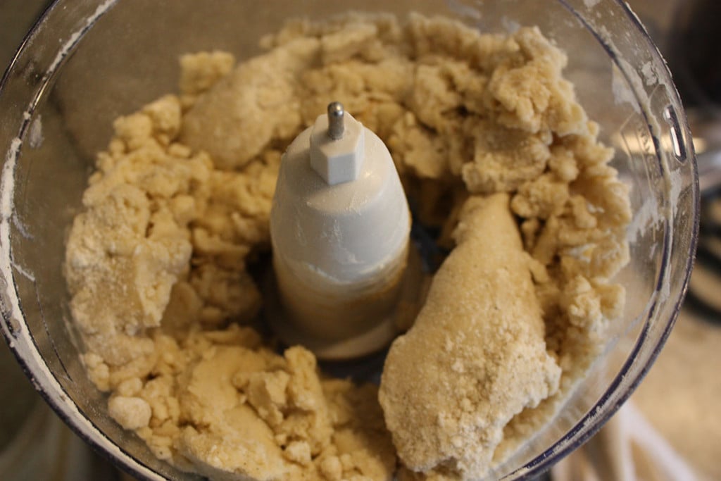 Cardamom Pistachio Cookie dough in the bowl of a food processor