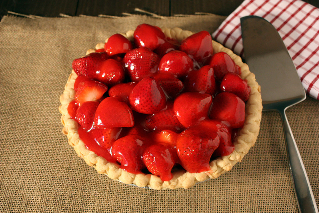 Fresh Strawberry Pie on a table with burlap.