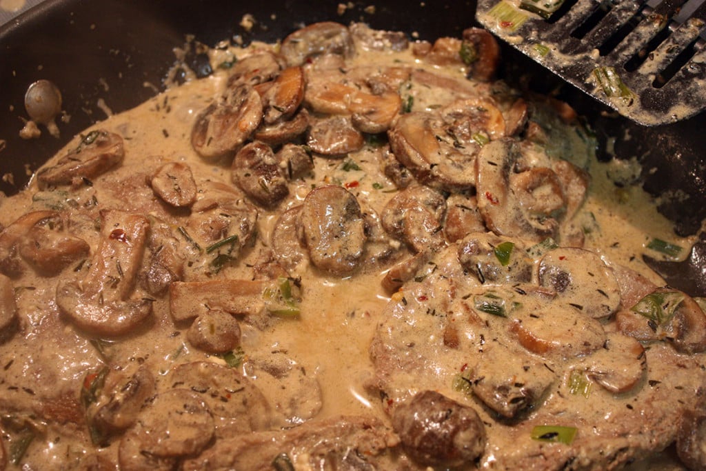 Turkey salisbury steaks and mushroom gravy in a large skillet.