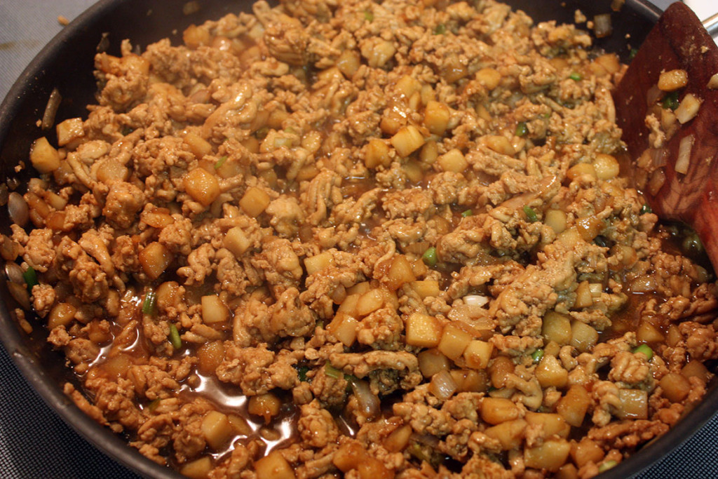 Chicken lettuce wrap mixture in a skillet.