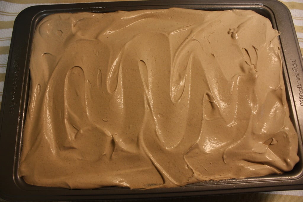 baked Italian love cake in the pan with the frosting on top