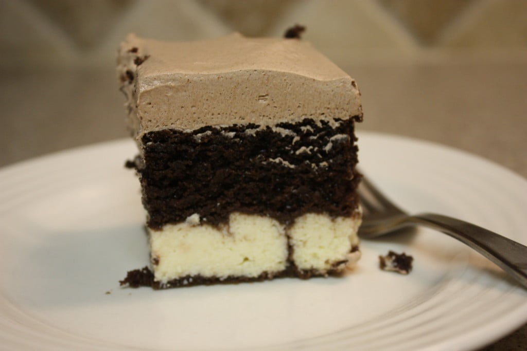 Chocolate italian love cake with a fork on a white plate.