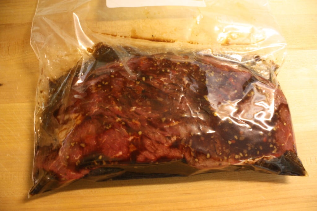 Meat marinating in a zip lock bag.