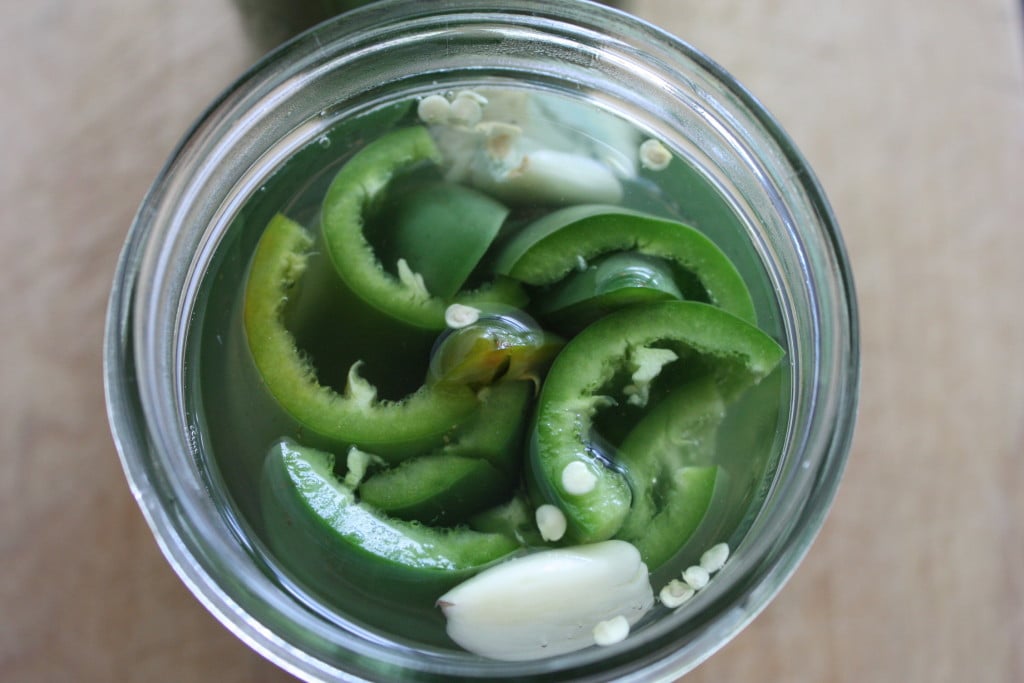 Pickled jalapeno peppers in a mason jar.