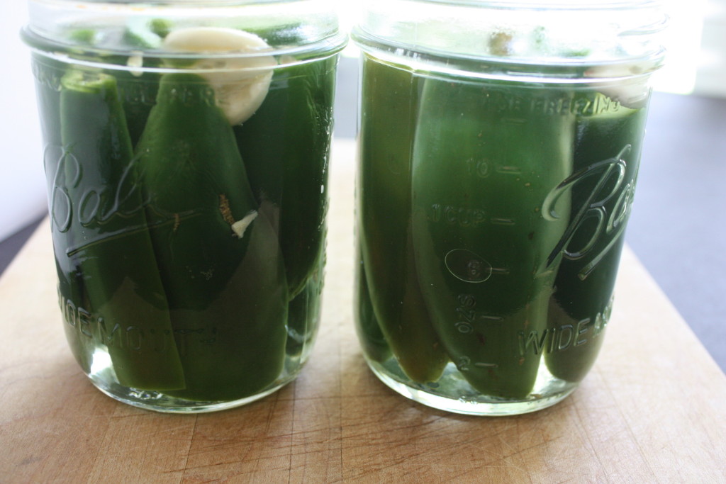 Pickled jalapeno peppers in mason jars.