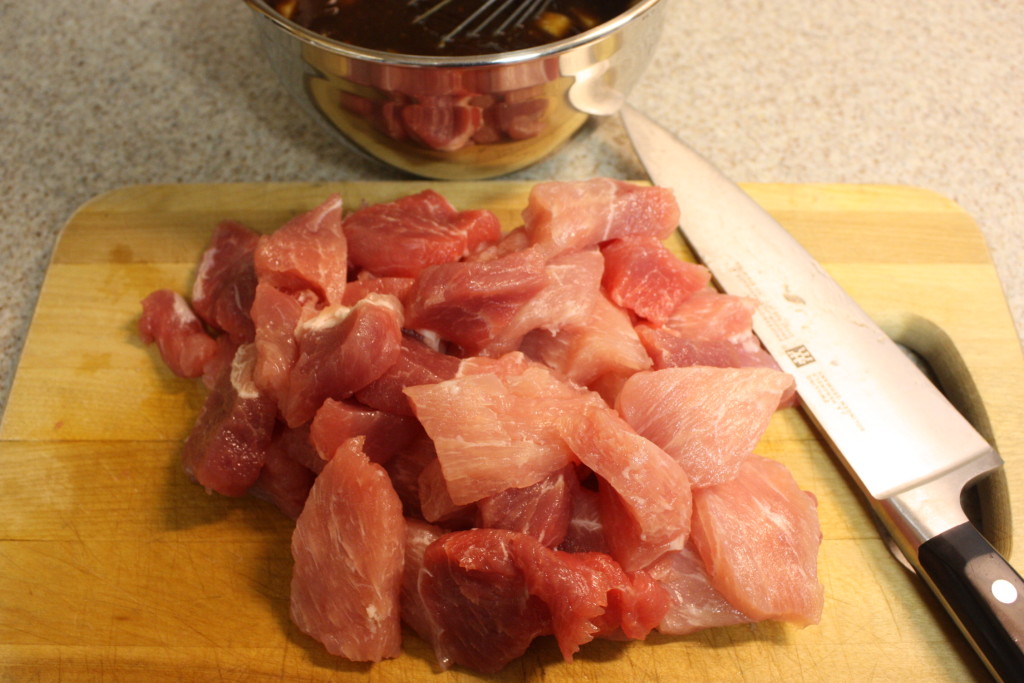 cubed pork butt on a board