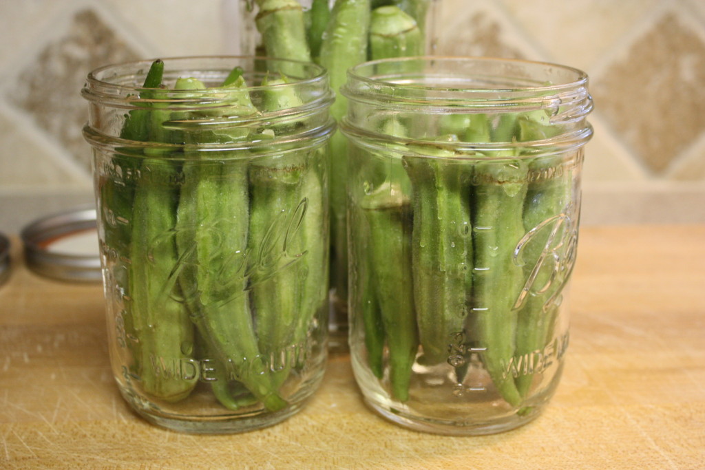 Okra pods in mason jars.