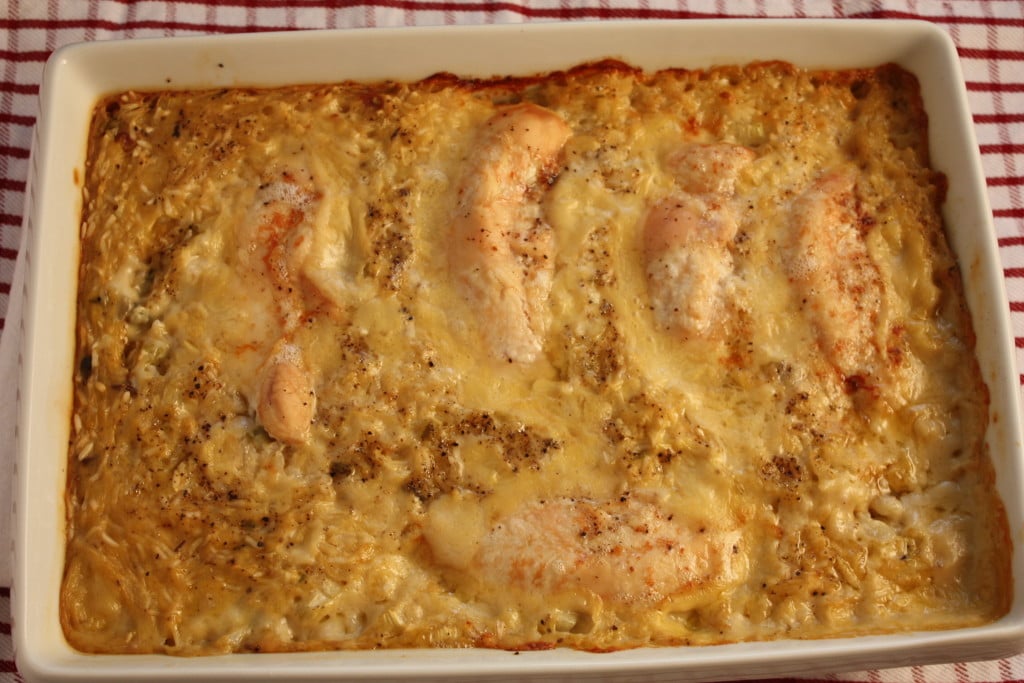 One Pan Baked Chicken and Rice in a white baking dish.