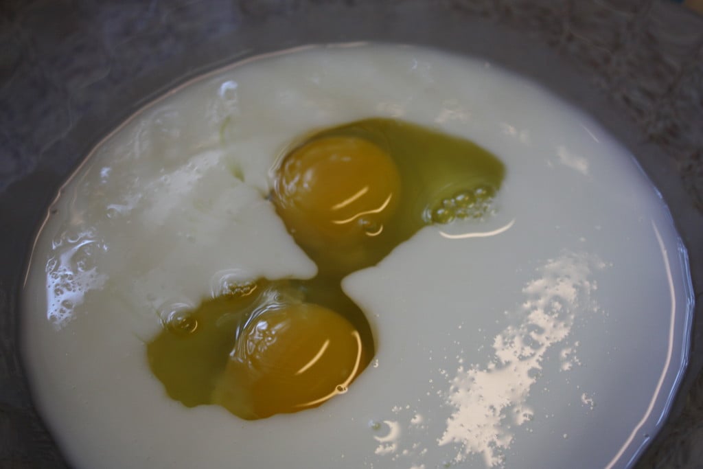 Buttermilk and eggs in a bowl.