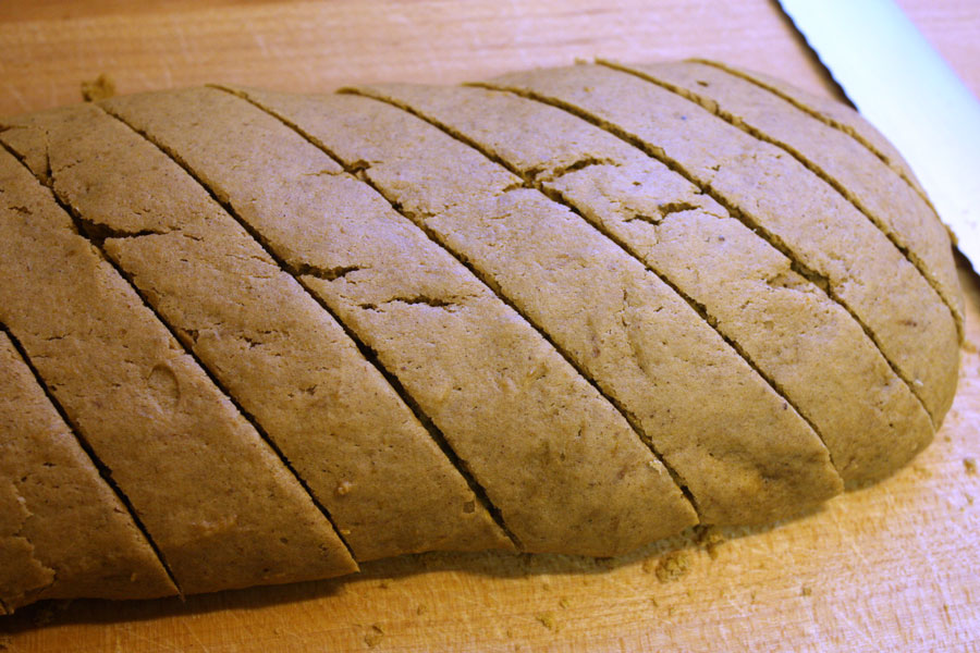 baked pumpkin biscotti sliced on a wooden board