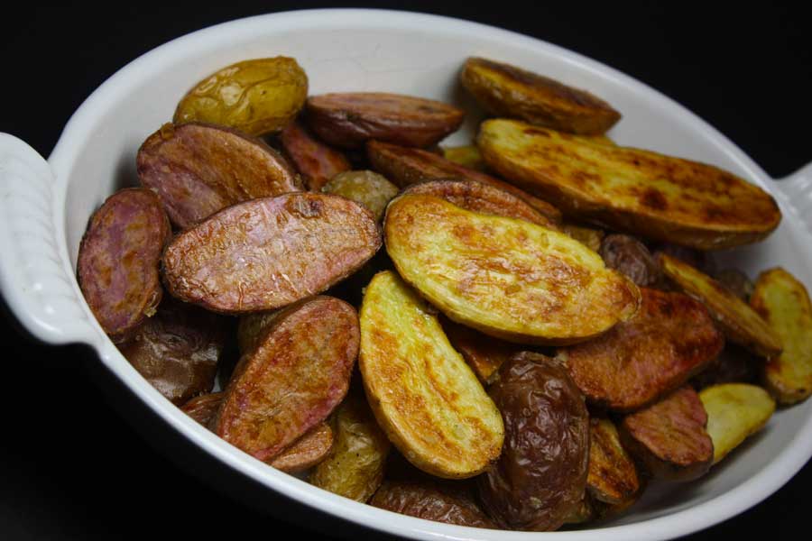 Roasted Fingerling Potatoes in a white baking dish.