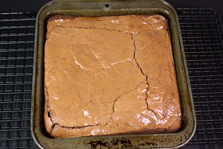 Brownies baked in the pan on a wire rack