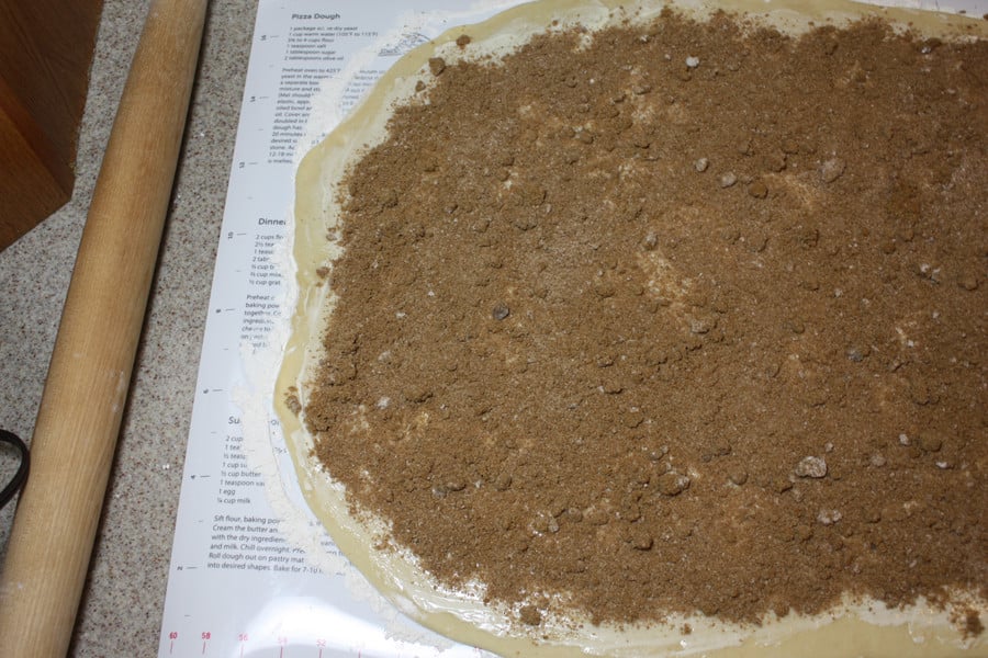 Dough rolled out with sugar mixture spread over the entire surface.
