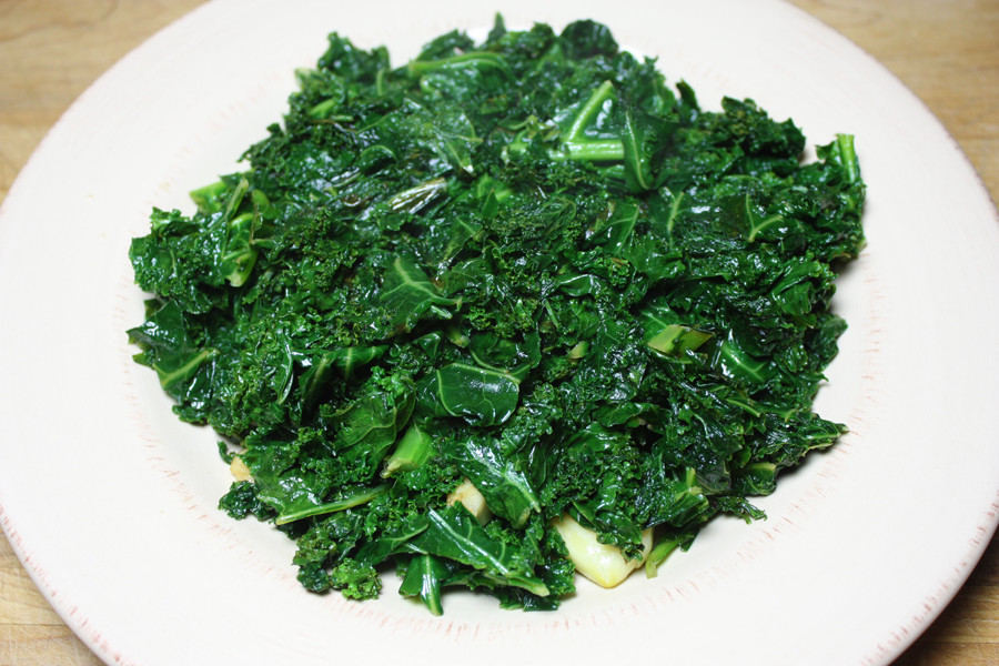 Sautéed Kale on a white plate.