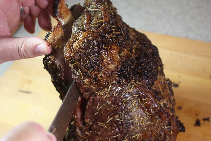 The bone being cut off the Prime Rib.