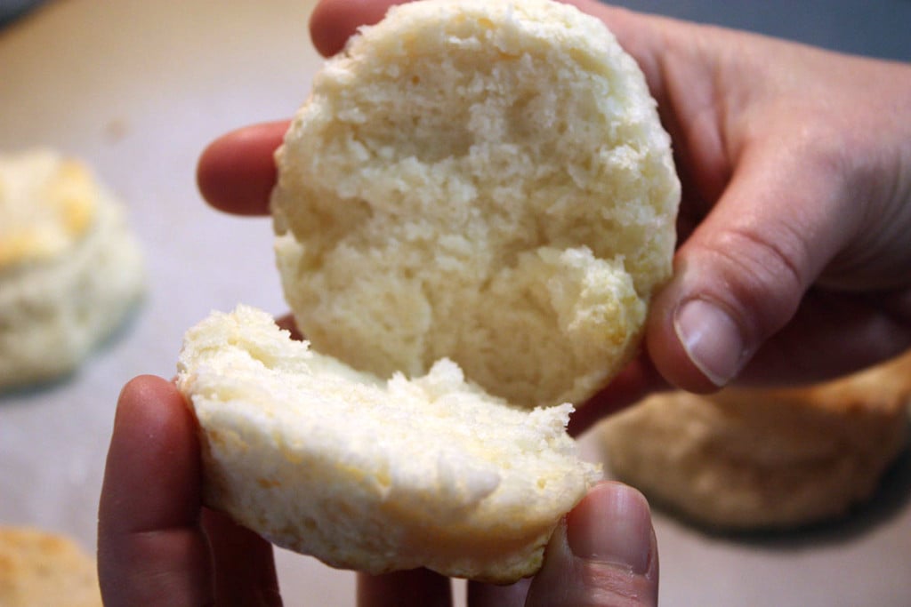 Buttermilk biscuit sliced in half.