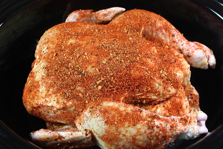 Slow Cooker Rotisserie Chicken - raw chicken rubbed in spices in the crock