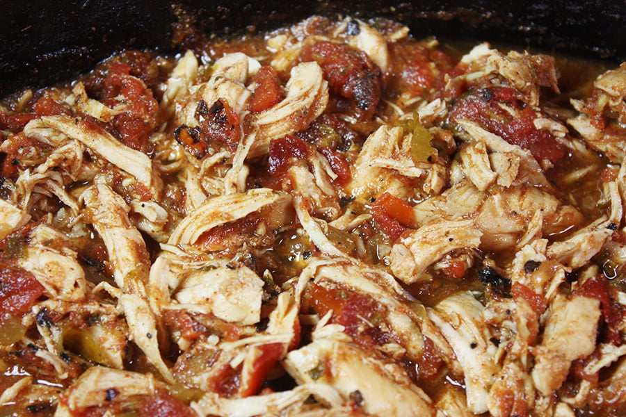 Slow Cooker Mexican Chicken shredded in the crock of the slow cooker.