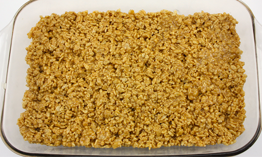 Cereal mixture in a glass baking dish.