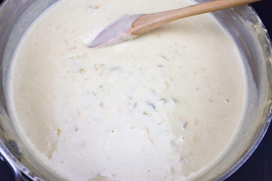 Restaurant Style Queso Dip in a metal sauce pan
