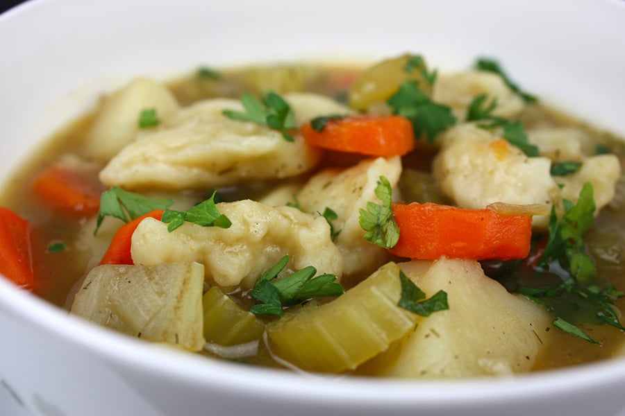 Vegetable Dumpling Soup in a white bowl