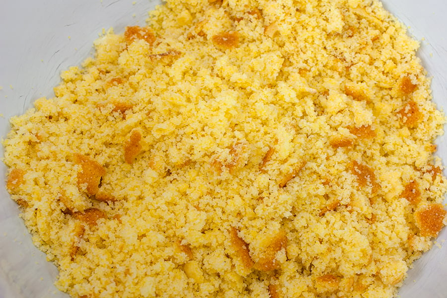 Southern Cornbread Dressing - cornbread crumbled in a white bowl