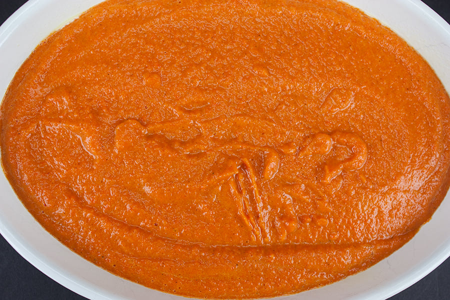 unbaked Carrot Souffle in a white casserole dish