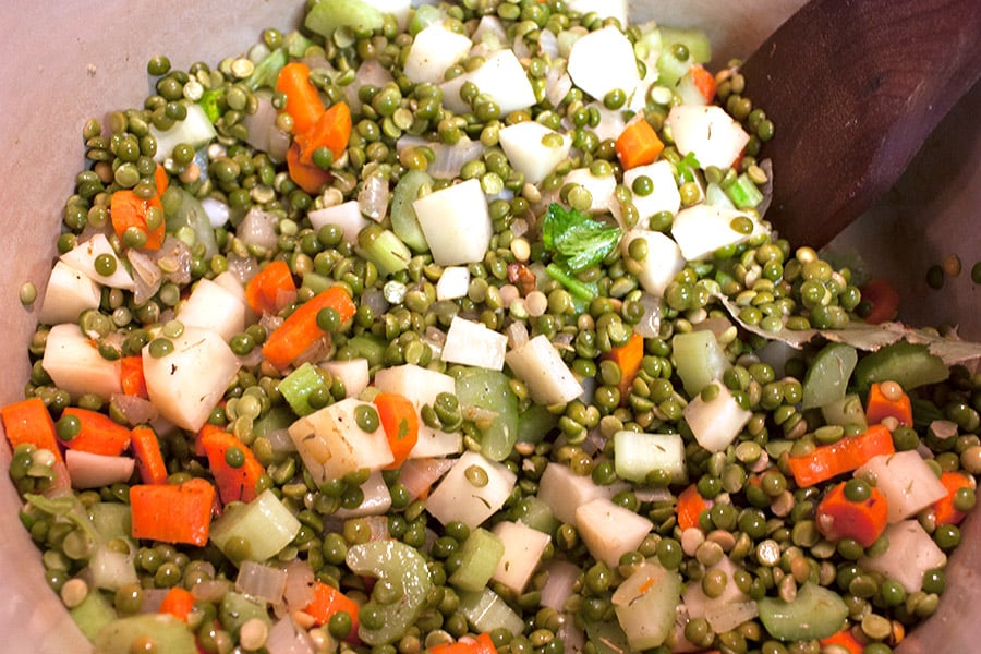 Split peas, and vegetables in a pot.