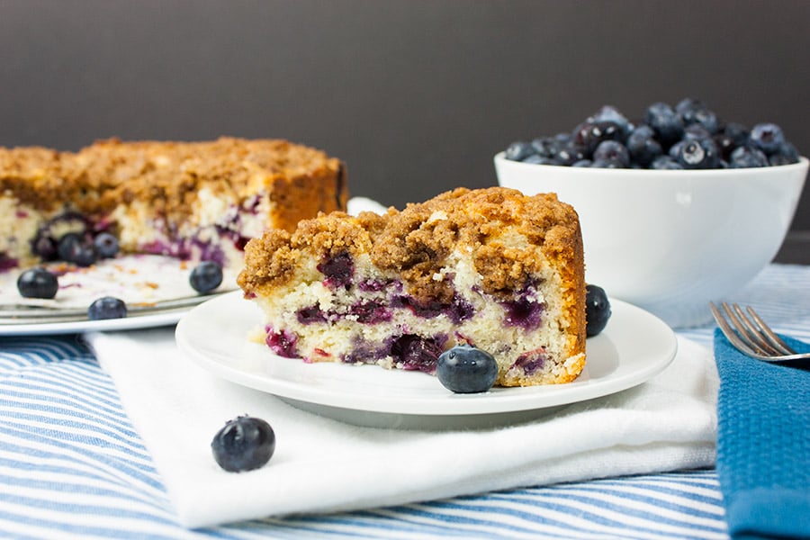 a slice of the Blueberry Streusel Coffee Cake on a white plate