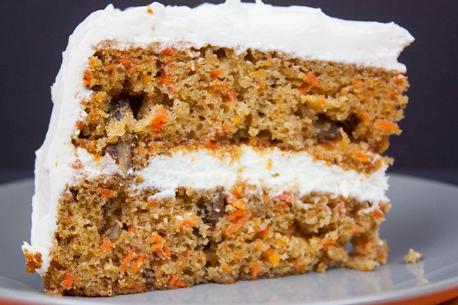 A slice of carrot cake on gray plate,