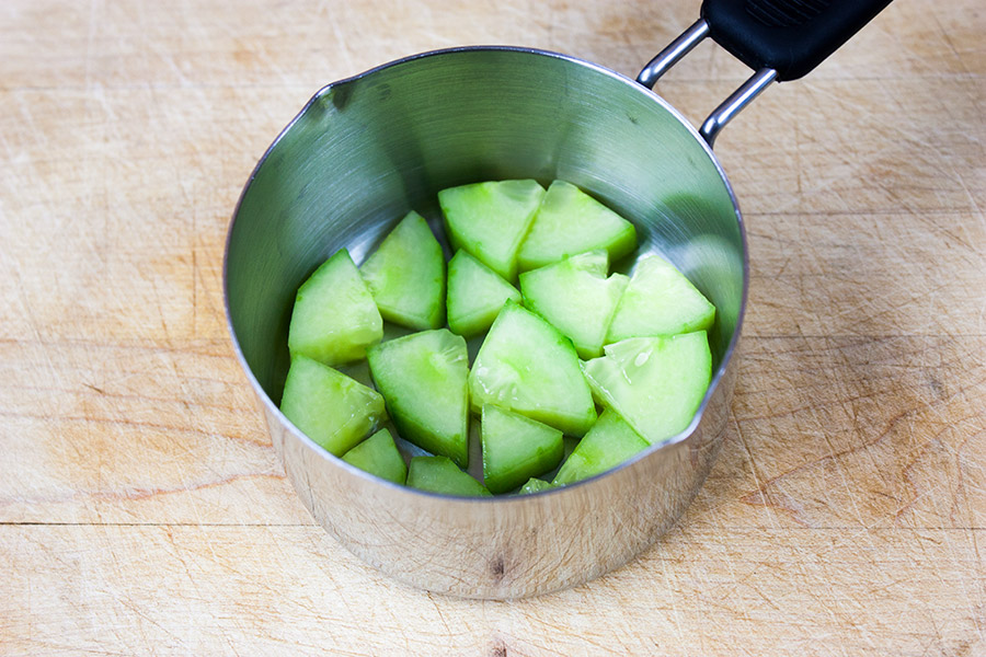 Spicy Shrimp Sushi Stack - cucumber in the bottom of a metal measuring cup