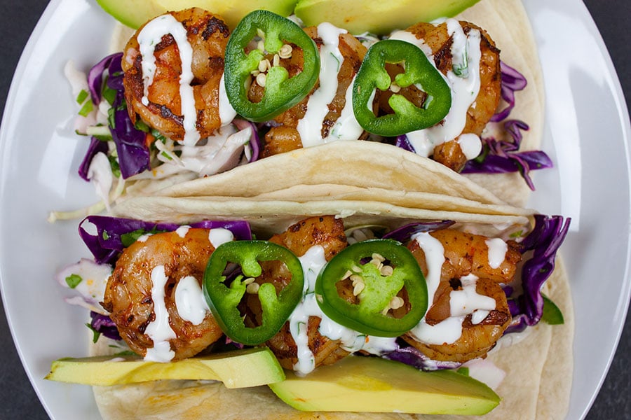 Cilantro Lime Slaw Shrimp Tacos on a white plate.