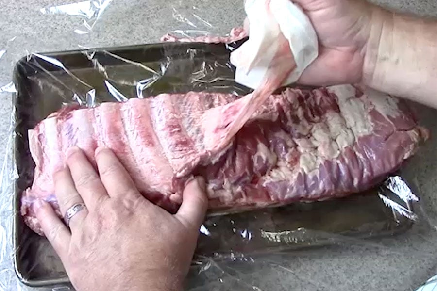 St Louis Style Ribs - the membrane being pulled of the ribs