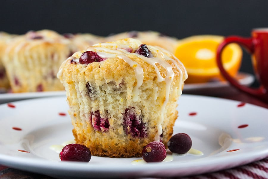 Cranberry Orange Muffin on white plate with red dots 