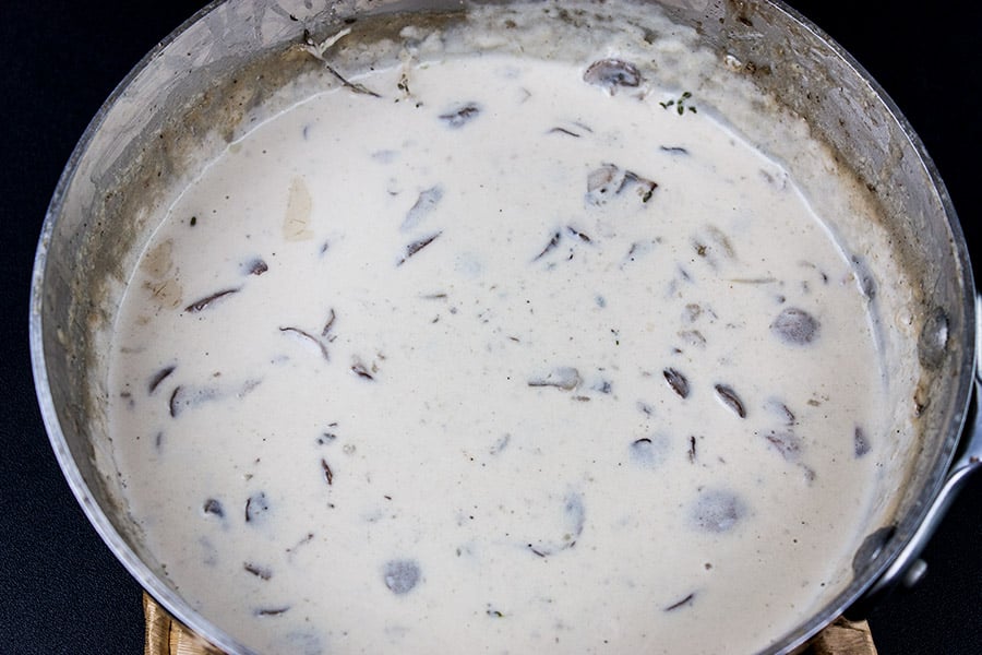Homemade creamy mushroom sauce in a saucepan.