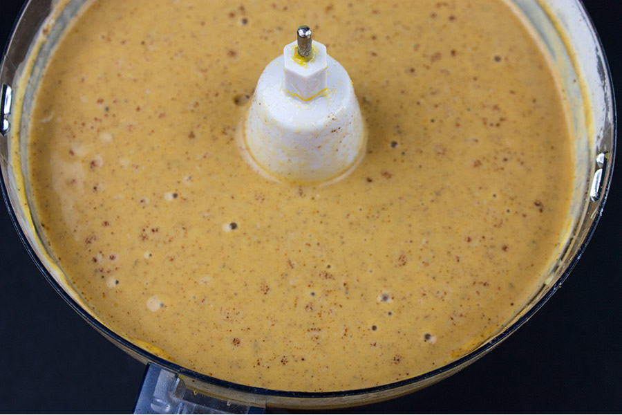 Gingersnap Crust pumpkin pie filling combined in the bowl of a food processor