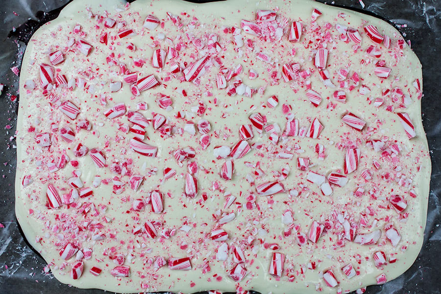 Dark chocolate peppermint bark in one solid piece on baking sheet.