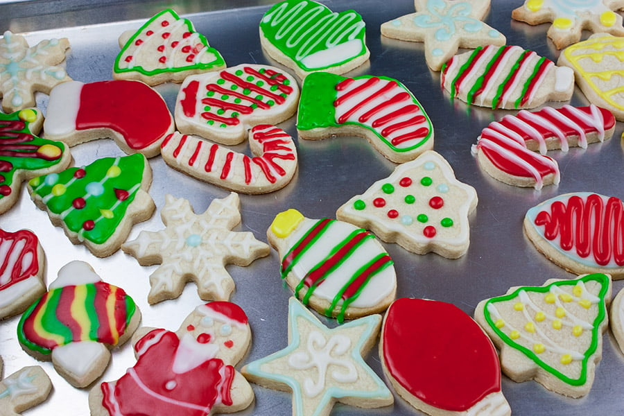 Decorated cut-out sugar cookies on a baking sheet.