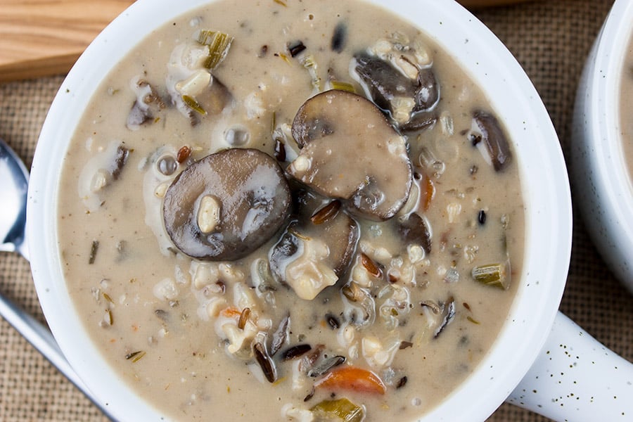 Wild rice and mushroom soup in white crock.