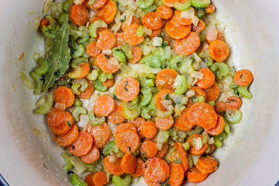 Celery, onions, and carrots sautéed with the flour in the pot.