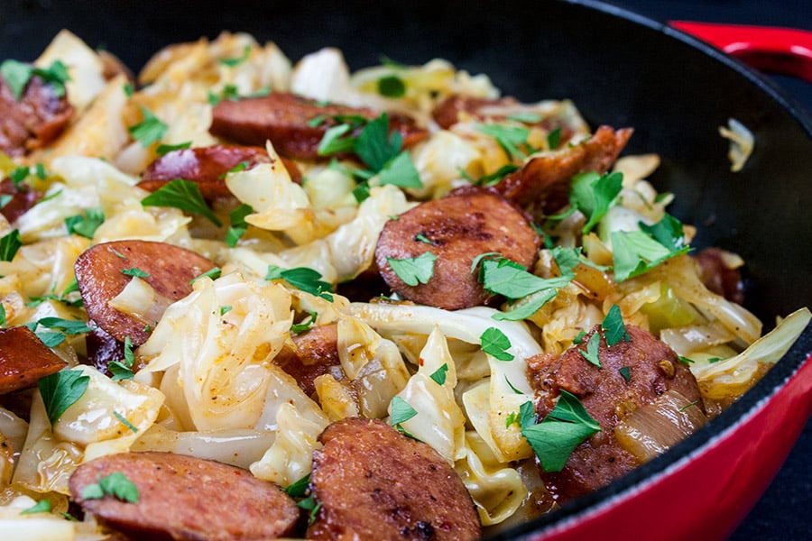 Fried Cabbage and Sausage -fried cabbage and sausage in red cast iron skillet