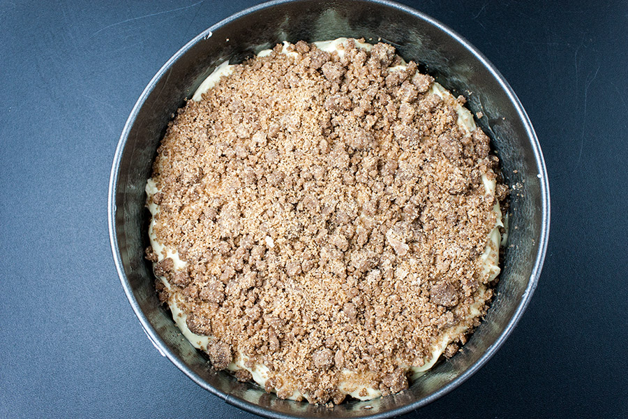 Cinnamon Crumb Coffee Cake batter topped with streusel in round springform pan