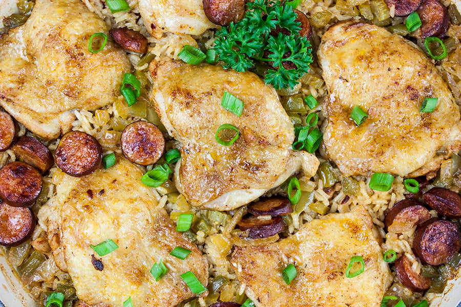 One Pot Chicken and Dirty Rice - baked chicken, rice and sausage in pan