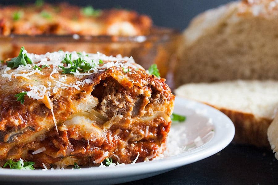Absolute Best Ever Lasagna - The ultimate lasagna! Three layers of deliciously rich, luscious meat sauce, creamy cheesy ricotta and perfectly cooked noodles. With a trick to getting a perfect portion cut every time. 
