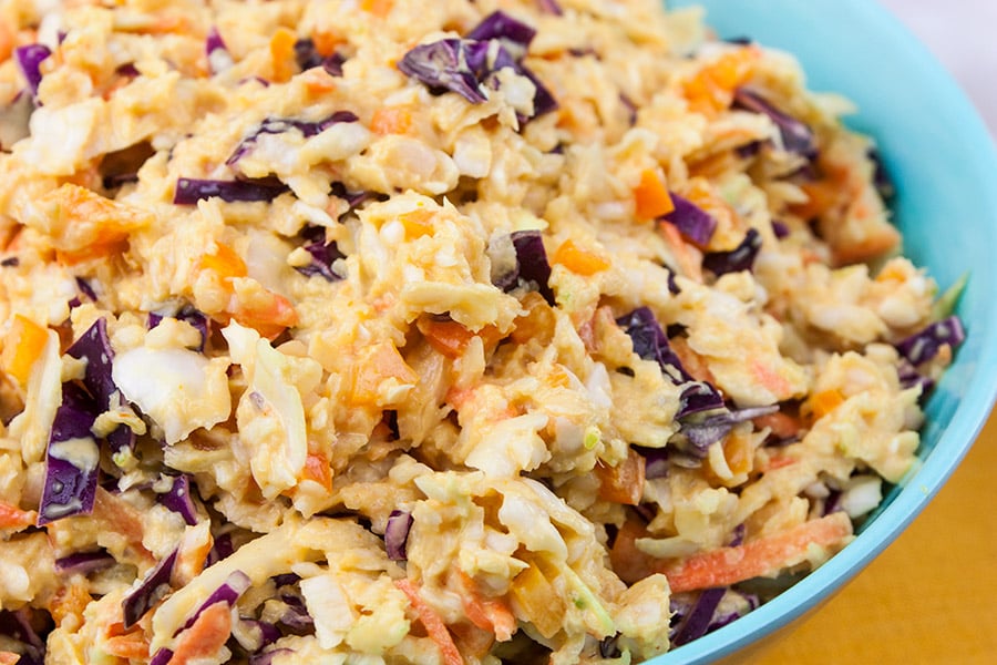 Tangy Southern Mustard Coleslaw - prepared slaw in a light blue bowl