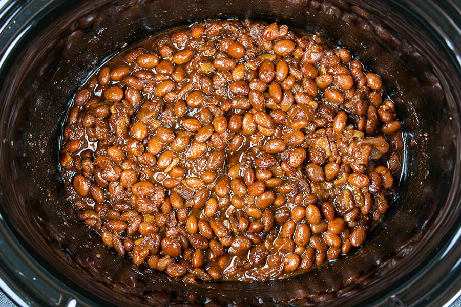 Slow Cooker Boston Baked Beans -  beans in the slow cooker done cooking and showing how thick the sauce is