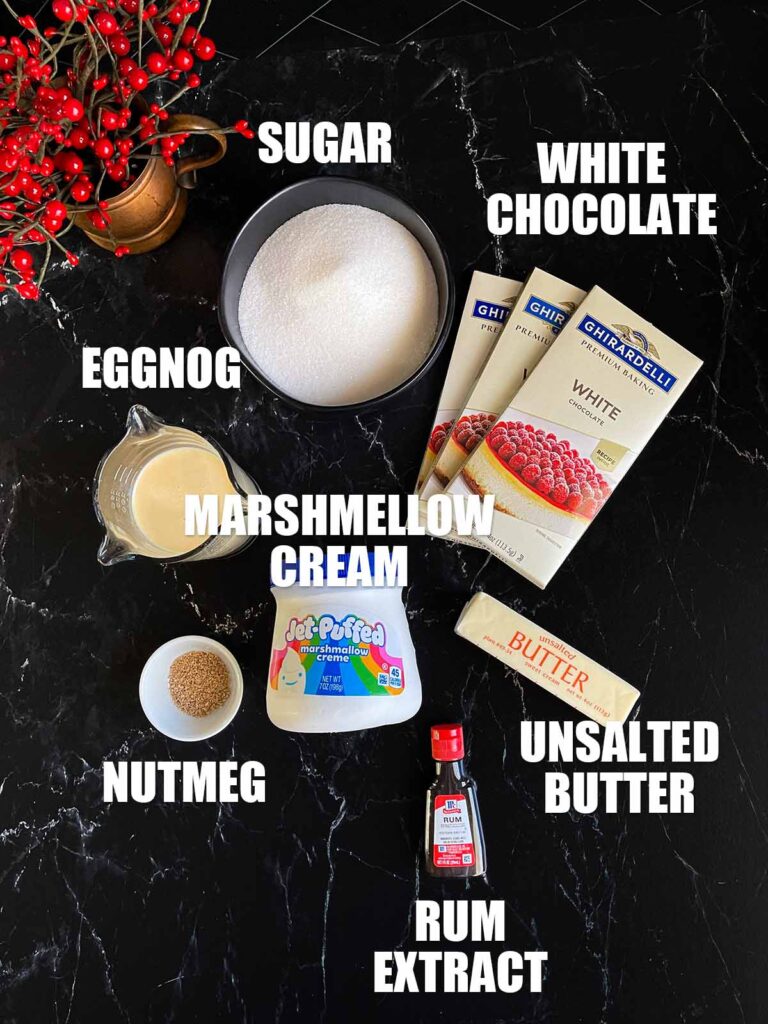 Eggnog fudge ingredients on a dark surface.